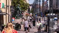 Photo shows people on a street in Tampere.
