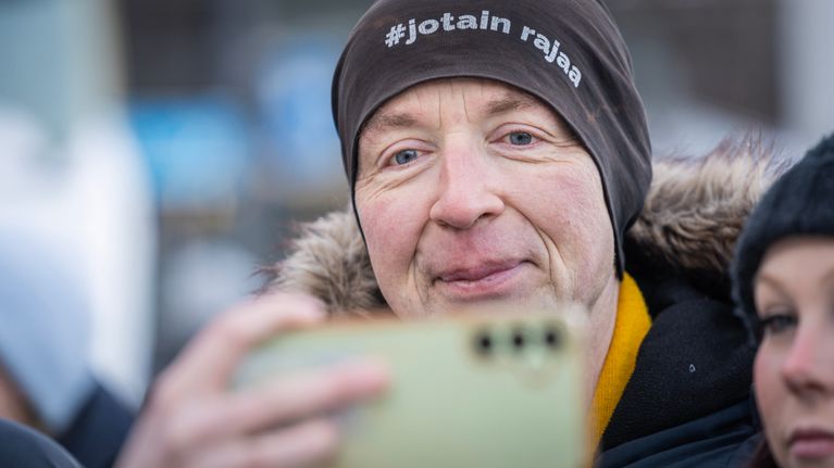 Finns Party presidential candidate Jussi Halla-aho taking a selfie while campaigning in Helsinki.