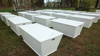 A group of white caskets.