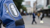 Photo shows the sleeve of a police overcoat.
