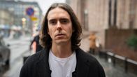 Venäläinen artisti Bogdan Drjomin kuvattuna hotelli Scandic Grand Centralissa marraskuussa 2023.
