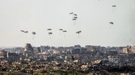 Photo shows relief aid supplies being dropped by parachute into the northern part of Gaza.