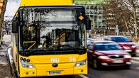 A yellow city bus in Turku, seen from the front.
