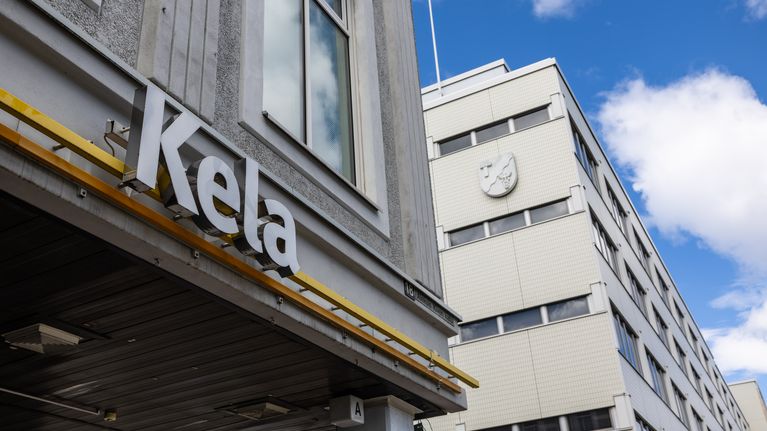 Building with a sign that says Kela.