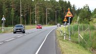 Photo shows a road with signs warning about elk.