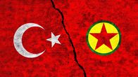 Turkiets och PKK:s flaggor målade på en mur.