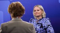 Two women, Riikka Purra and an interviewer, sitting in a television studio.
