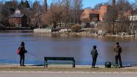 Photo shows people fishing near Helsinki.