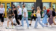 People walking in the street in summertime.