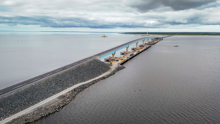 Aerial view of a road over a long causeway and bridge.