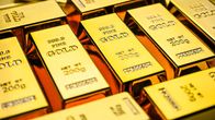 Guldtackor på rad med texten gold på dem.