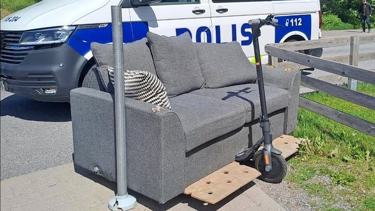 Photo shows a sofa and scooter combined.