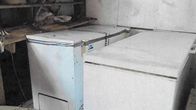 Photo shows two freezers in a storeroom.