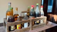 Dusty bottles in an old crate. 