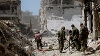 Syyrian armeijan sotilaita partiossa Homsin esikaupungissa.