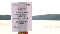 Veden laadusta varoitava kyltti Tampereen Kaukajärvellä