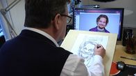 Teuvo Salminen piirtää karikatyyriä