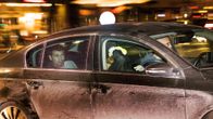 Tukholman iskusta epäilty Rakhmat Akilov kuvattuna poliisiautossa.