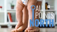 All Points North podcast logo featuring photo of baby standing on adult's feet.