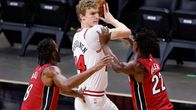  Lauri Markkanen #24 of the Chicago Bulls is defended by Trevor Ariza #8 and Jimmy Butler