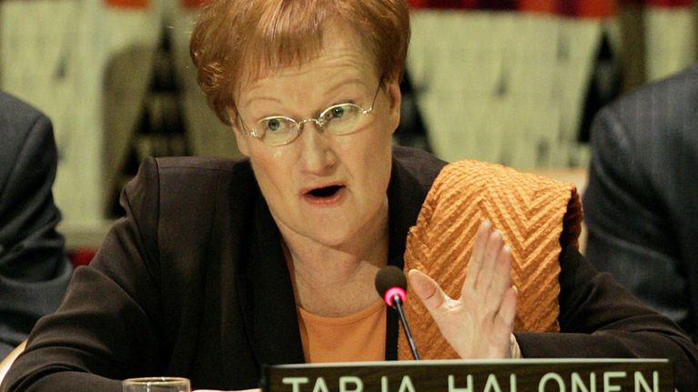 epa000279058 Finland's President Tarja Halonen gestures as she addressesd the high level meeting entitled 'A Fair Globalization Implementing the United Nations Millennium Declaration' at UN Headquarters in New York City Monday 20 September 2004. The General Debate of the General Assembly begins Tuesday 21 September at UN Headquarters