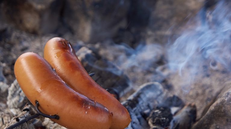 Grilling sausages.