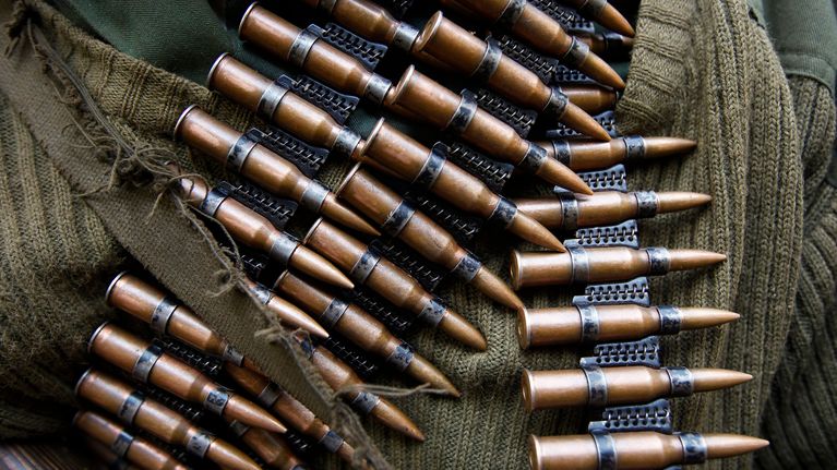 A Congolese government soldier wears a belt of ammunitions as he stands guard at their headquarters in the town of Minova, some 45km from the provincial capital Goma, Democratic Republic of Congo, 24 November 2012